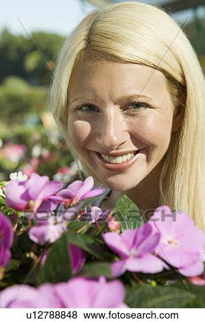 Woman Holding Flowers, portrait View Large Photo Image Stock Photo - Woman Holding Flowers, portrait. Fotosearch