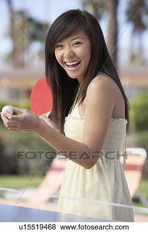 Woman in summer dress playing ping pong View Large Photo Image Stock Photo - Woman in summer dress playing ping pong. Fotosearch