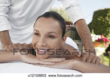 Stock Image - Woman Receiving a Massage, head and shoulders. Fotosearch