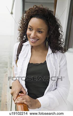 Woman relaxing on yacht, (portrait) View Large Photo Image Picture - Woman relaxing on yacht, (portrait). Fotosearch