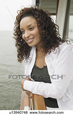 Woman relaxing on yacht, (portrait) View Large Photo Image Stock Photo - Woman relaxing on yacht, (portrait). Fotosearch
