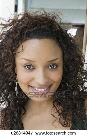 Woman smiling, (portrait), (close-up) View Large Photo Image Stock Photo - Woman smiling, (portrait), (close-up). Fotosearch