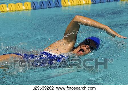 Stock Image - Woman swimming in pool, (close-up). Fotosearch