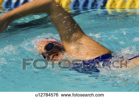 Woman swimming in pool, (close-up) View Large Photo Image Stock Photograph - Woman swimming in pool, (close-up). Fotosearch