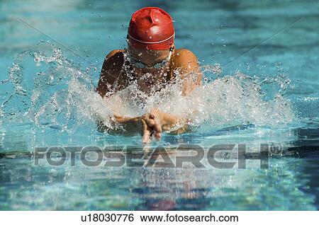 Woman swimming in pool View Large Photo Image Stock Photograph - Woman swimming in pool. Fotosearch