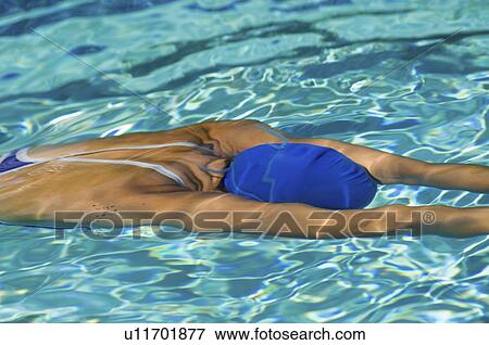 Woman swimming underwater View Large Photo Image Stock Photo - Woman swimming underwater. Fotosearch