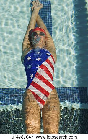 Woman swimming underwater View Large Photo Image Stock Photo - Woman swimming underwater. Fotosearch