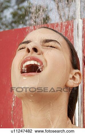 Woman Using Outdoor Shower, head shot, close up View Large Photo Image Stock Image - Woman Using Outdoor Shower, head shot, close up. Fotosearch