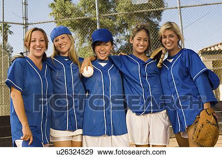 Stock Photo - Women's softball team on field, group portrait. Fotosearch
