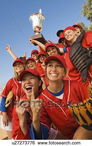 Women's softball team with trophy, portrait, low angle view View Large Photo Image Stock Photograph - Women's softball team with trophy, portrait, low angle view. Fotosearch