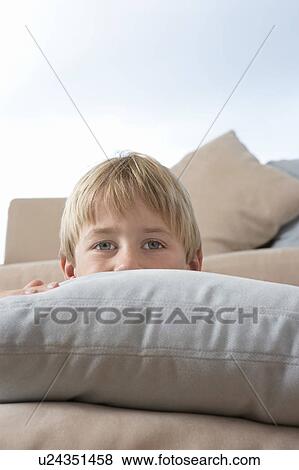 Young Boy Hiding Behind Pillows and cushions View Large Photo Image Stock Photo - Young Boy Hiding Behind Pillows and cushions. Fotosearch