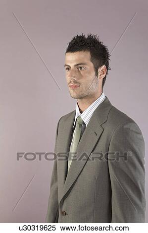 Young businessman wearing suit, portrait View Large Photo Image Stock Photography - Young businessman wearing suit, portrait. Fotosearch