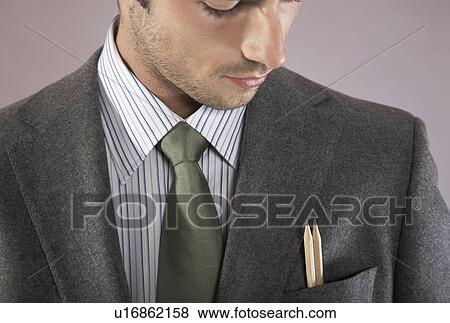 Young businessman with pencils in pocket, portrait View Large Photo Image Stock Photo - Young businessman with pencils in pocket, portrait. Fotosearch