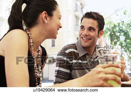 Picture - Young couple with drinks, portrait. Fotosearch