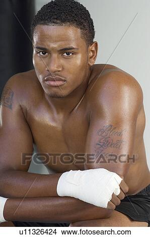 Picture - Young man with wrapped hands, portrait. Fotosearch