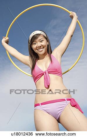Young Woman in bikini with hoop View Large Photo Image Stock Photograph - Young Woman in bikini with hoop. Fotosearch