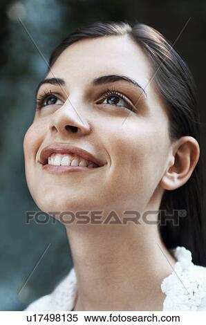 Young woman looking up, close up of head View Large Photo Image Stock Photography - Young woman looking up, close up of head. Fotosearch