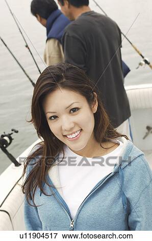 Young woman on sport fishing trip, (portrait) View Large Photo Image Stock Photo - Young woman on sport fishing trip, (portrait). Fotosearch