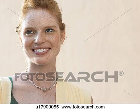 Young woman smiling, outdoors, portrait View Large Photo Image Stock Photography - Young woman smiling, outdoors, portrait. Fotosearch
