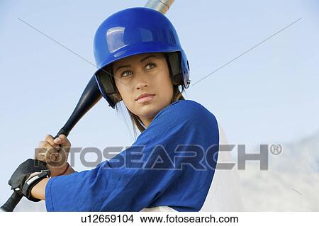 Picture - Young woman with softball bat, portrait. Fotosearch