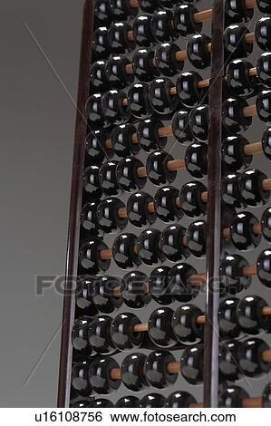 Abacus, close up of rows of black beads View Large Photo Image Stock Photograph - Abacus, close up of rows of black beads. Fotosearch