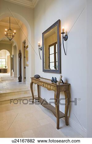 Antique console table with grey framed mirror in hallway View Large Photo Image Stock Image - Antique console table with grey framed mirror in hallway. Fotosearch