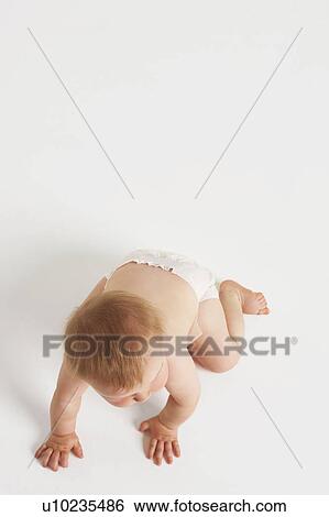 Stock Photograph - Baby crawling. Fotosearch