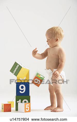 Baby Knocking Over Blocks View Large Photo Image Picture - Baby Knocking Over Blocks. Fotosearch