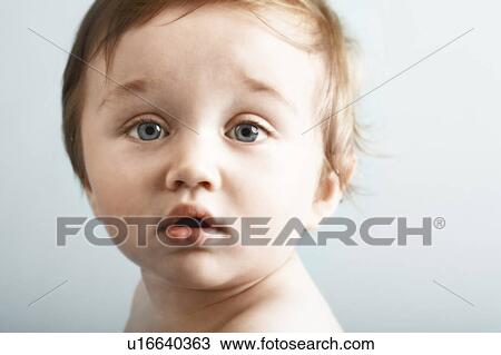 Stock Image - Baby looking at camera. Fotosearch