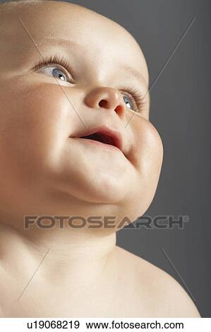 Stock Photo - Baby Looking Up. Fotosearch