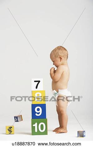 Stock Image - Baby Playing With Building Blocks. Fotosearch