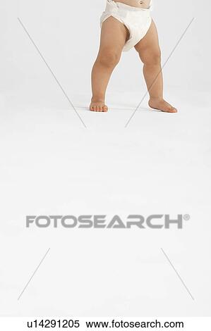 Baby Standing, low section View Large Photo Image Stock Photography - Baby Standing, low section. Fotosearch