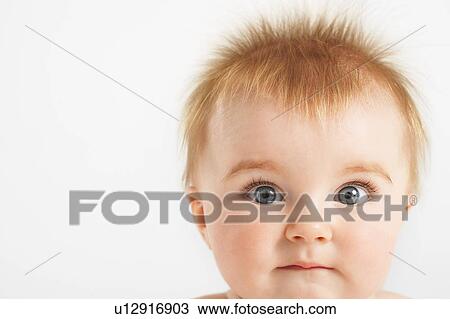 Baby with fuzzy hair biting lip View Large Photo Image Stock Image - Baby with fuzzy hair biting lip. Fotosearch