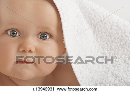 Baby with wearing towel over head View Large Photo Image Stock Image - Baby with wearing towel over head. Fotosearch