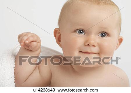 Stock Photo - Baby with white towel. Fotosearch