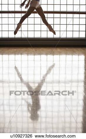 Ballerina in mid-air, window and reflection View Large Photo Image Stock Photograph - Ballerina in mid-air, window and reflection. Fotosearch