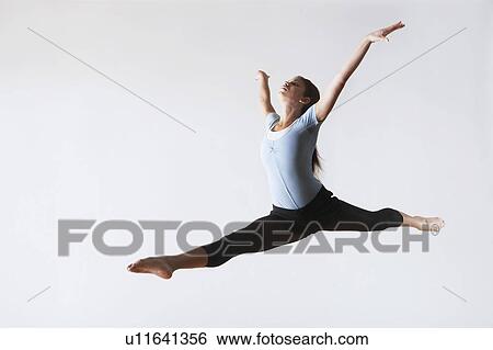 Ballerina Leaping in Mid-air View Large Photo Image Stock Photograph - Ballerina Leaping in Mid-air. Fotosearch