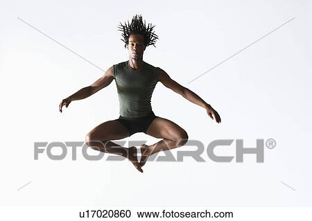 Stock Image - Ballet dancer, leaping in mid-air. Fotosearch