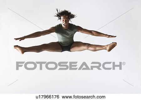 Stock Photograph - Ballet dancer, leaping in mid-air. Fotosearch