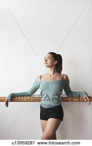 Stock Photo - Ballet Dancer relaxing at bar. Fotosearch
