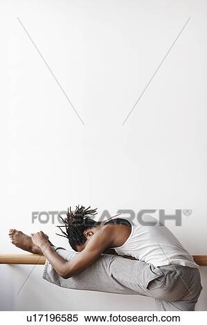 Ballet Dancer stretching at bar View Large Photo Image Stock Photography - Ballet Dancer stretching at bar. Fotosearch