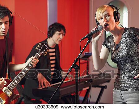 Band in recording studio View Large Photo Image Stock Photo - Band in recording studio. Fotosearch