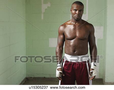 Stock Photo - Bare-chested boxer, portrait. Fotosearch