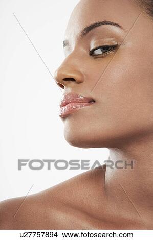 Beautiful young black woman looking from corner of eye View Large Photo Image Picture - Beautiful young black woman looking from corner of eye. Fotosearch