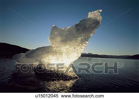 Stock Photography - Block of ice in ocean. Fotosearch