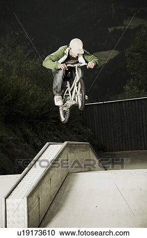 BMX rider in mid-air View Large Photo Image Stock Image - BMX rider in mid-air. Fotosearch