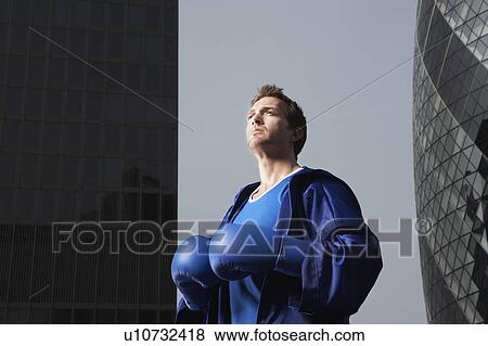 Boxer standing between downtown buildings, low angle view, London, England View Large Photo Image Stock Photo - Boxer standing between downtown buildings, low angle view, London, England. Fotosearch