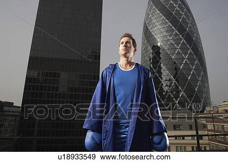 Boxer standing on downtown rooftop, London, England View Large Photo Image Stock Photo - Boxer standing on downtown rooftop, London, England. Fotosearch