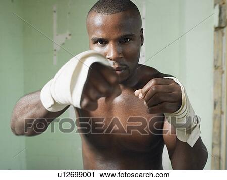 Boxer with raised fists, portrait View Large Photo Image Stock Image - Boxer with raised fists, portrait. Fotosearch