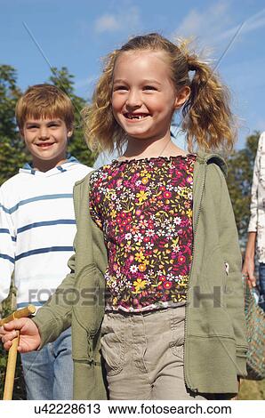 Brother and sister walking on track to beach View Large Photo Image Stock Image - Brother and sister walking on track to beach. Fotosearch